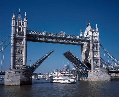 The Dixie Queen boat is so big that Tower Bridge has to be raised as it chugs along the Thames in London. Click to see full-size version of picture